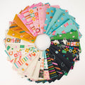 A circular arrangement of colorful sewing notion themed patterned fabric swatches on a white background, showing many different prints and colors including pink, teal, green, orange, black, and white.