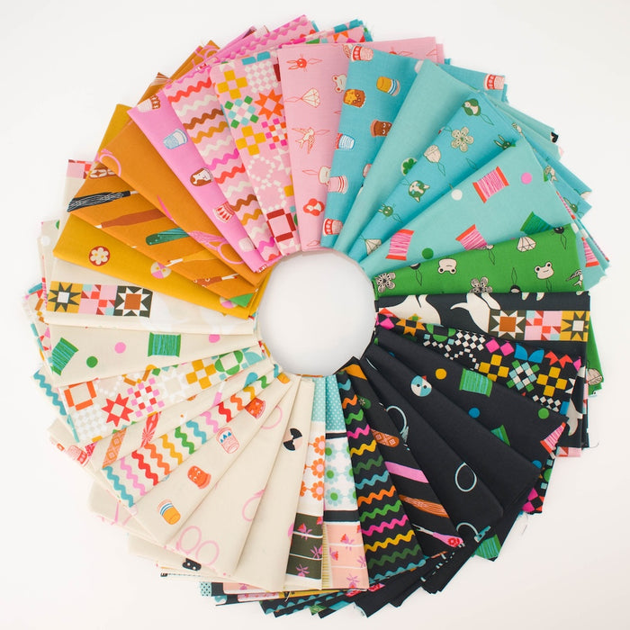 A circular arrangement of colorful sewing notion themed patterned fabric swatches on a white background, showing many different prints and colors including pink, teal, green, orange, black, and white.