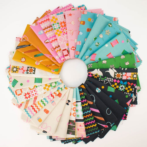 A circular arrangement of colorful sewing notion themed patterned fabric swatches on a white background, showing many different prints and colors including pink, teal, green, orange, black, and white.