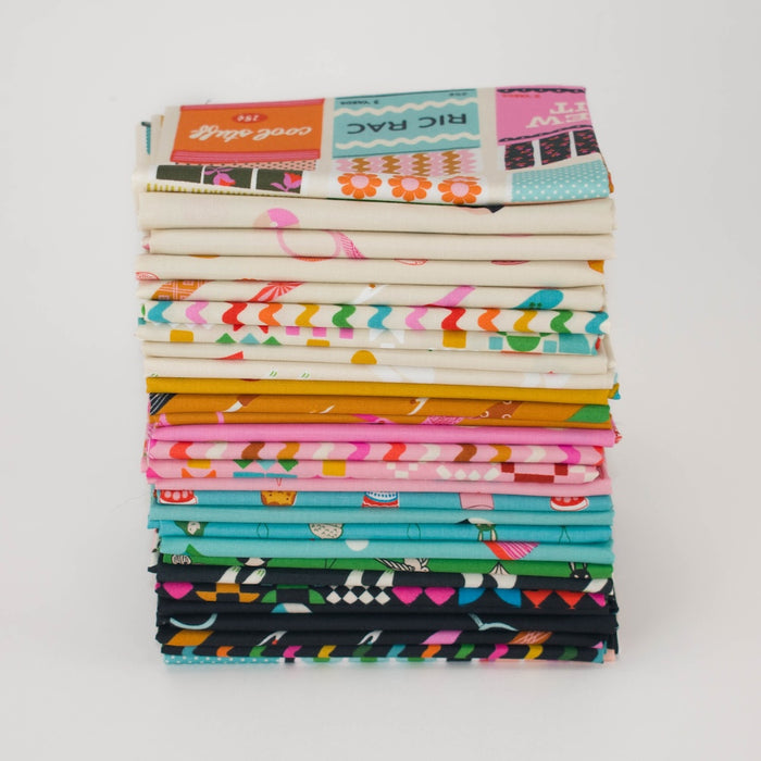A stack of folded patterned fabric pieces in various colors and designs, photographed on a plain white background.