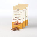 Three packages of Sweet Shop USA Pecan Brags Minis on a white background