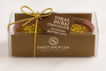 Box of Viral Dubai Chocolate Pistachio Butter Cups with a gold ribbon on a white background