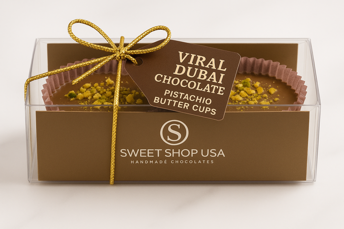 Box of Viral Dubai Chocolate Pistachio Butter Cups with a gold ribbon on a white background