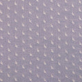 Patterned fabric with small stitched birds on a blue background