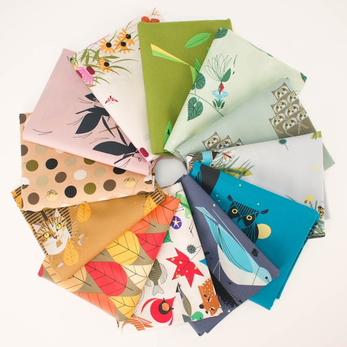 A circular arrangement of multiple fabric squares with different illustrated patterns, including leaves, owls, flowers, dots, and various birds, photographed on a plain white background.
