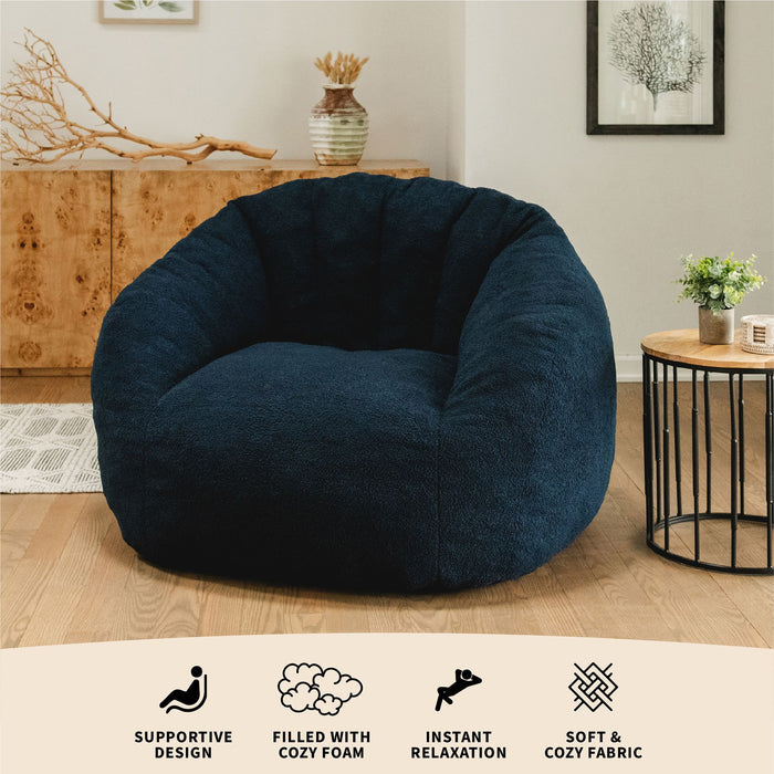 Features of the cloudberry lounge chair as it sits in a living room setting. #color_deep-blue-teddy-boucle