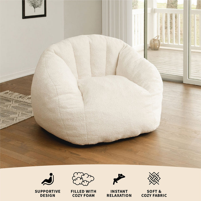 Cloudberry lounge chair for adults in the living room with feature descriptions #color_icing-teddy-boucle
