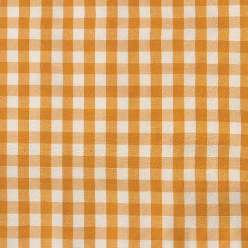 A close-up of a yellow and white gingham checkered fabric pattern.