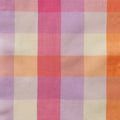 A close-up of a plaid fabric pattern with soft pastel stripes in pink, lavender, orange, peach, and cream.