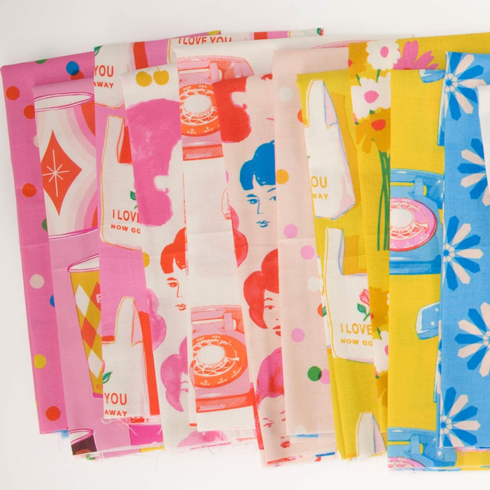 A fan-like arrangement of colorful patterned fabric with illustrations of a vintage inspired shopping at a market- with cans, telephones, shopping bags, faces, and florals, in pinks, reds, yellows, and blues.