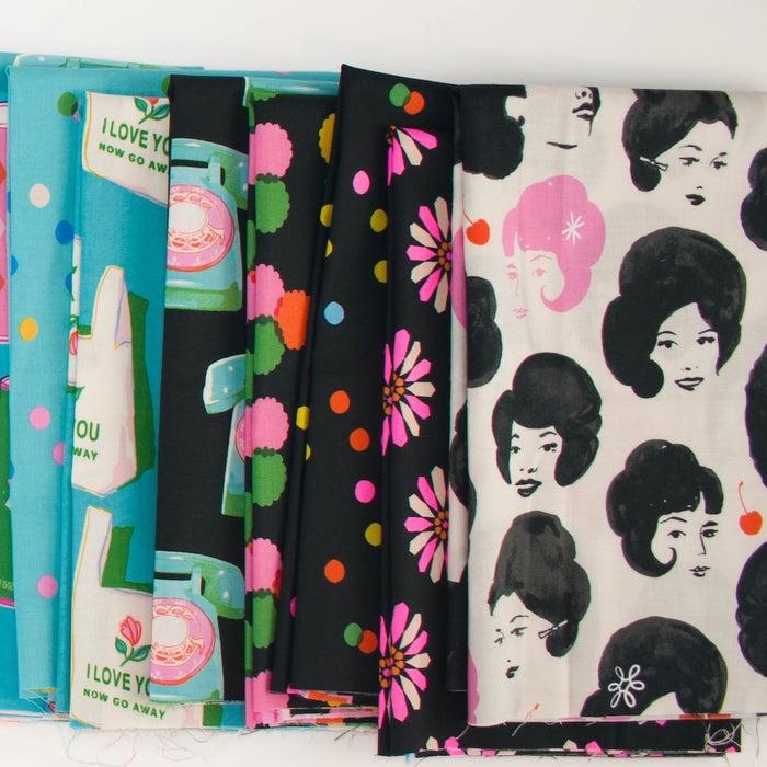 A fan-like arrangement of colorful patterned fabric with illustrations of a vintage inspired shopping at a market- with dots, telephones, shopping bags, faces, and florals, in pinks, black and white, and blues.