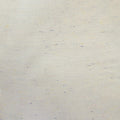 A close-up of a light cream or off-white textured material with subtle multicolored flecks and a fine woven or brushed texture.