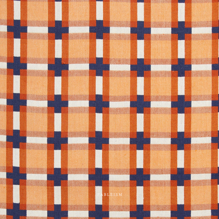 Plaid pattern with orange, blue, and white colors on fabric