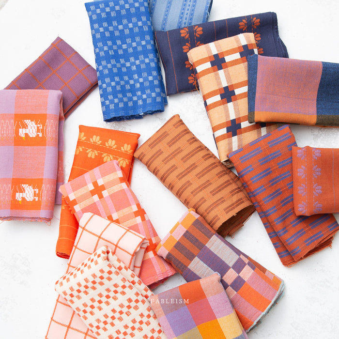 Collection of patterned fabric swatches in various colors on a white background