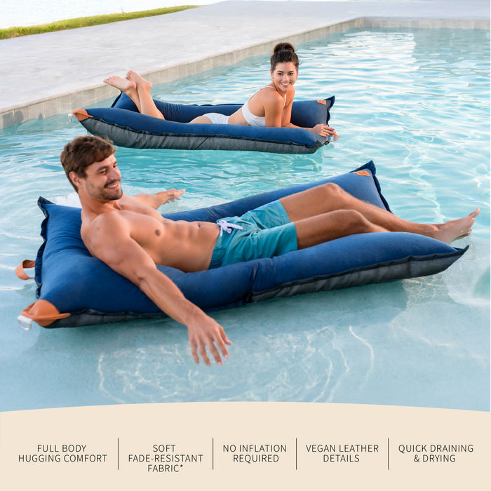 Two people relaxing on inflatable bean bags in a pool with product features listed below. #color_harbor-blue-sunbrella-fabric