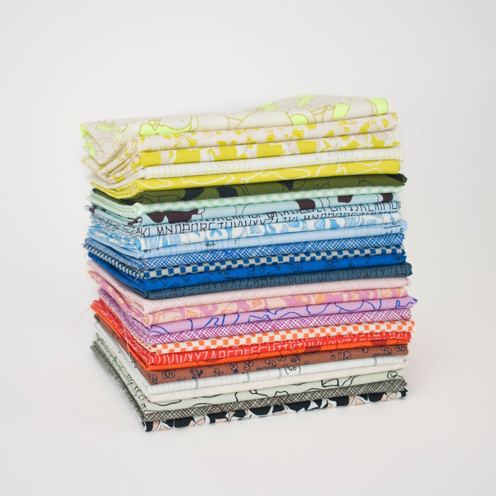 A stack of folded patterned fabric in assorted colors and abstract designs, photographed on a clean white background.