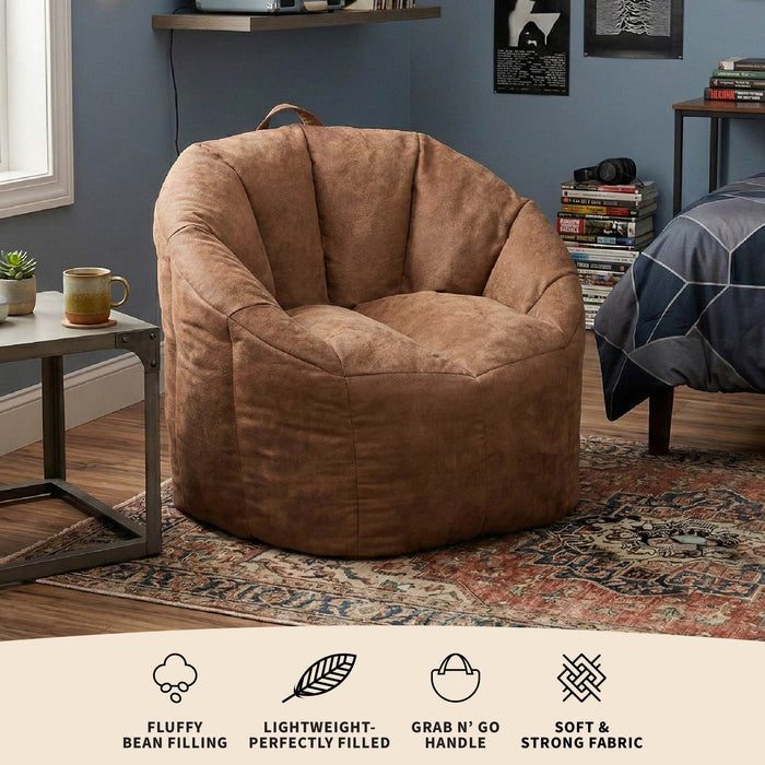 Brown bean bag chair in a room with a shelf and books. #color_chestnut-vegan-suede