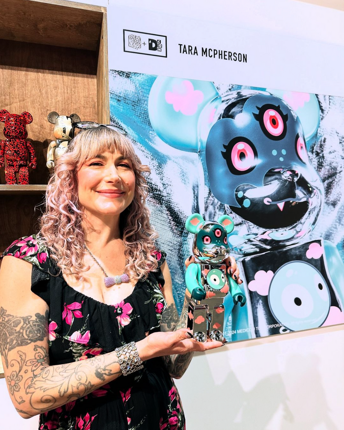 Tara McPherson holding her 400% BE@RBRICK at Designer Con