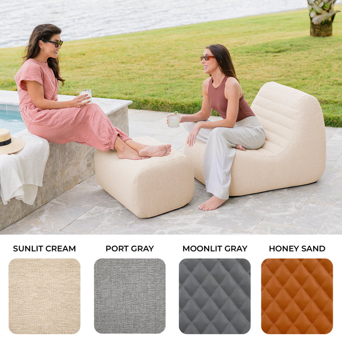 Two women sitting on lounge chairs by a body of water, with color swatches below. #color_sunlit-cream-outdoor-performance-linen