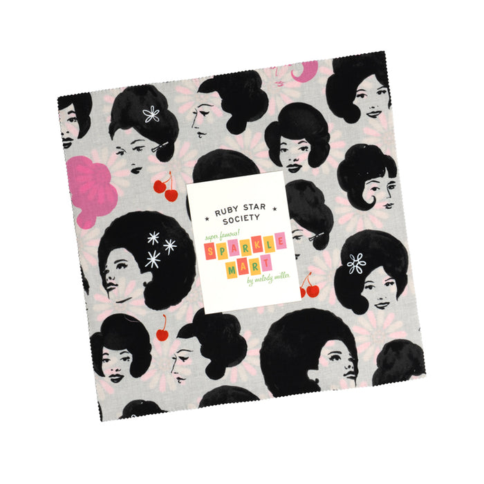 Patterned fabric with black hair silhouettes and a label card from Ruby Star Society on a white background