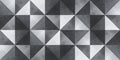 Geometric pattern of triangles in black, white, and gray on a textured surface.