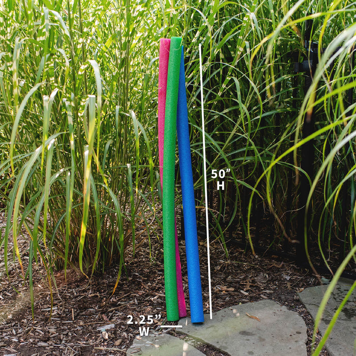 Three foam pool noodles in pink, green, and blue standing upright in a garden, with a white height marker showing 50 inches and a width marker showing 2.25 inches. #color_blue-green-pink
