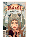 Front cover of the comic book Vertigo Presents: Thessaly, Witch for Hire #1, featuring an illustrated young woman wearing a frog hood with tentacles, holding blood-stained hands against a pale sky background. Signed by Tara McPherson