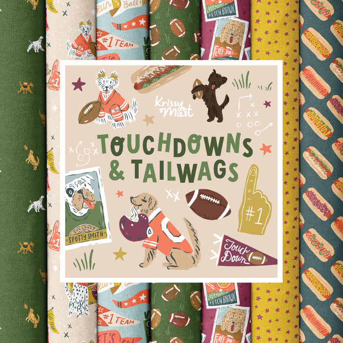 A square book or booklet cover titled "Touchdowns & Tailwags" by Krissy Mast, featuring cartoon dogs in football gear, football motifs, and sports-themed illustrations, centered over a background of patterned fabric swatches.