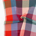 Multicolored checkered fabric with Fableism brand name on a white background