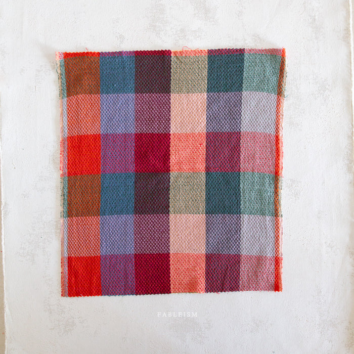 Plaid fabric square on a white background
